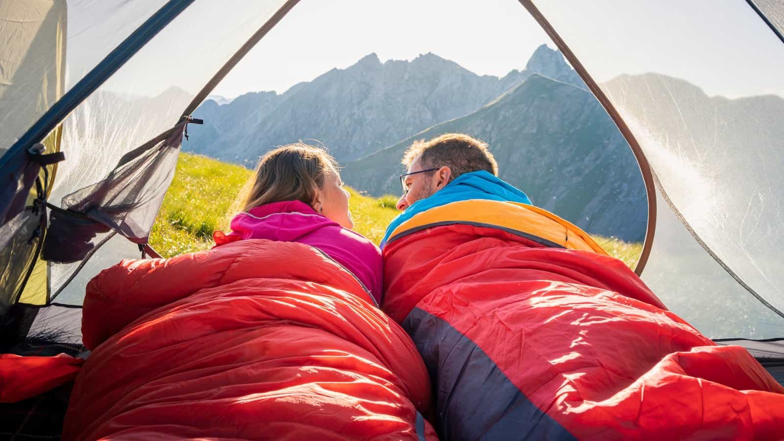budget synthetic sleeping bags in use during a camping trip