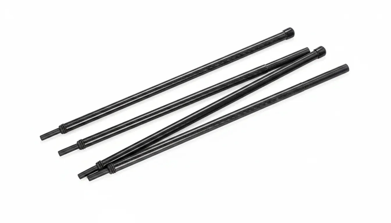 Four black tent poles for outdoor camping, hiking, and adventure gear.