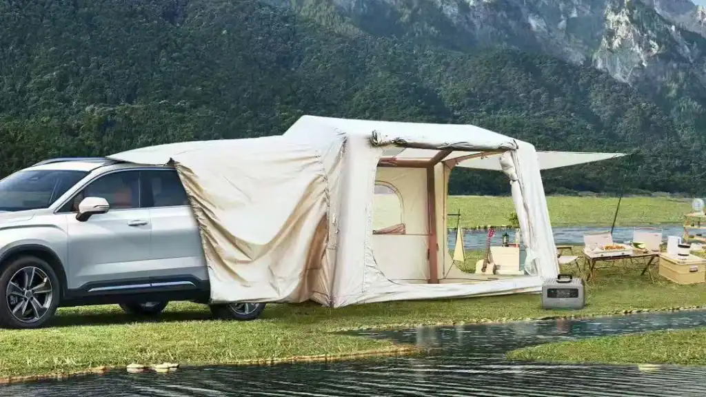 Car with attached tent for outdoor camping at Kelyland Outdoors.