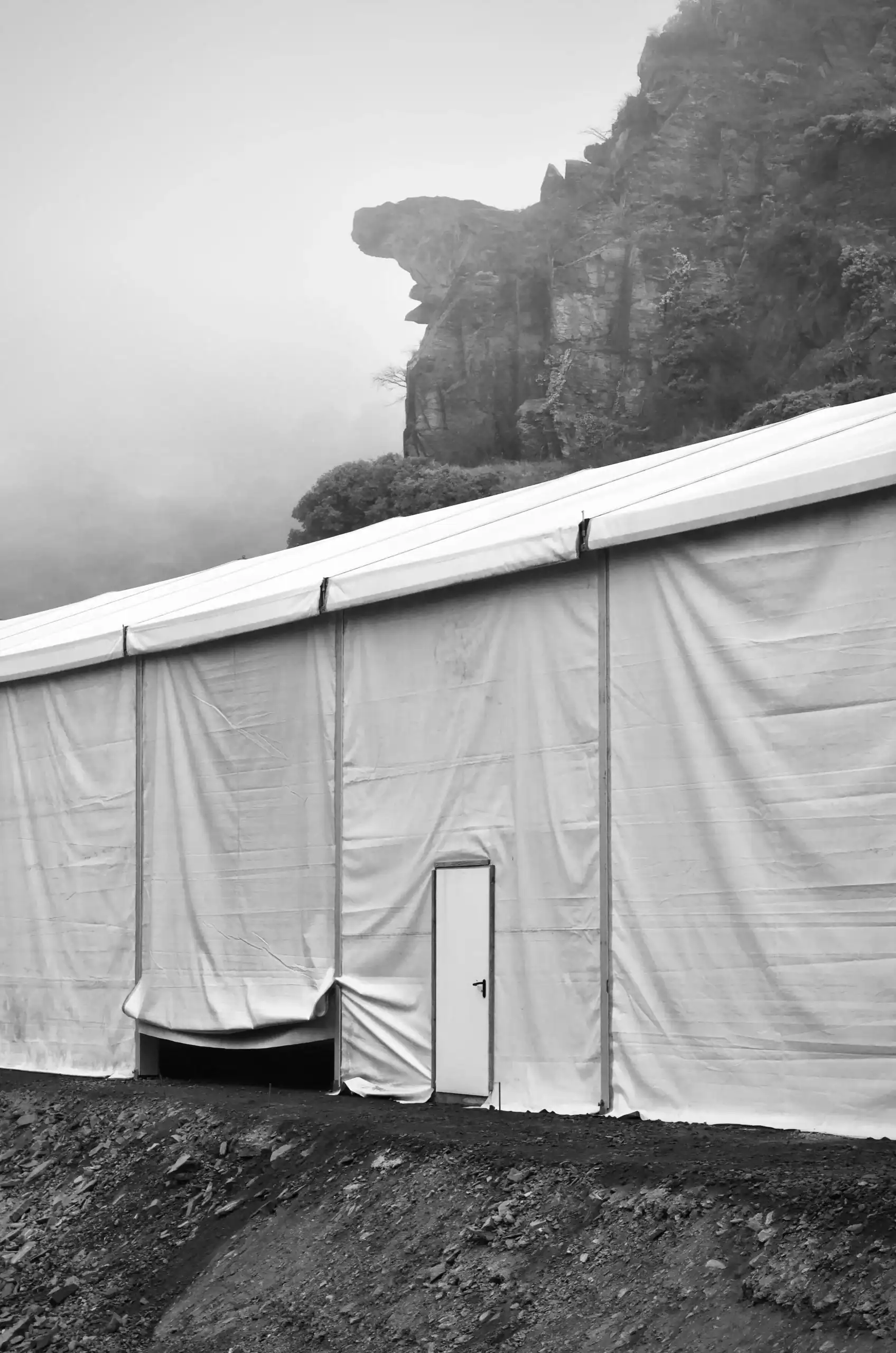Outdoor event tent at Kelyland Outdoors in a natural setting.
