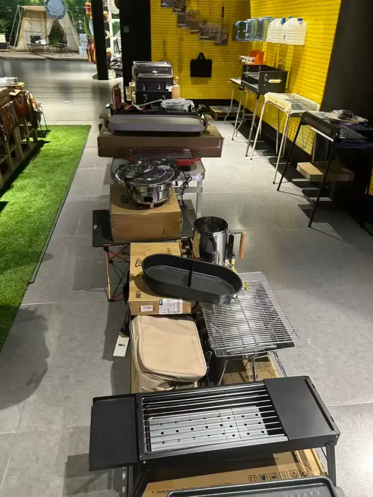 Camp Grill Brand Scaling: Kelyland Case Study 4 Outdoor grilling and cooking equipment display at Kelyland Outdoors store.