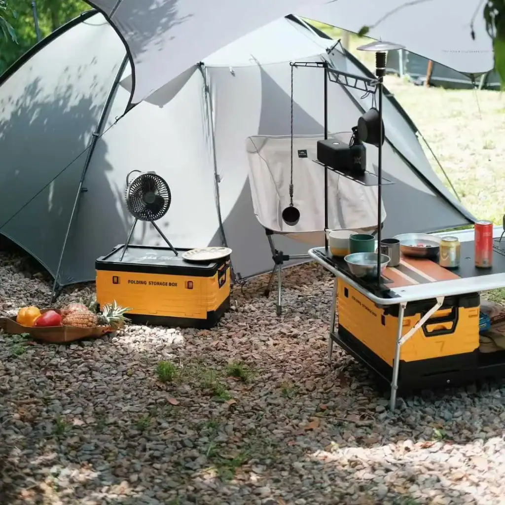 Retail Camp Stove Margin: Charcoal vs Gas 1 Camping setup with tent, table, and cooking gear outdoors at Kelyland Outdoors.