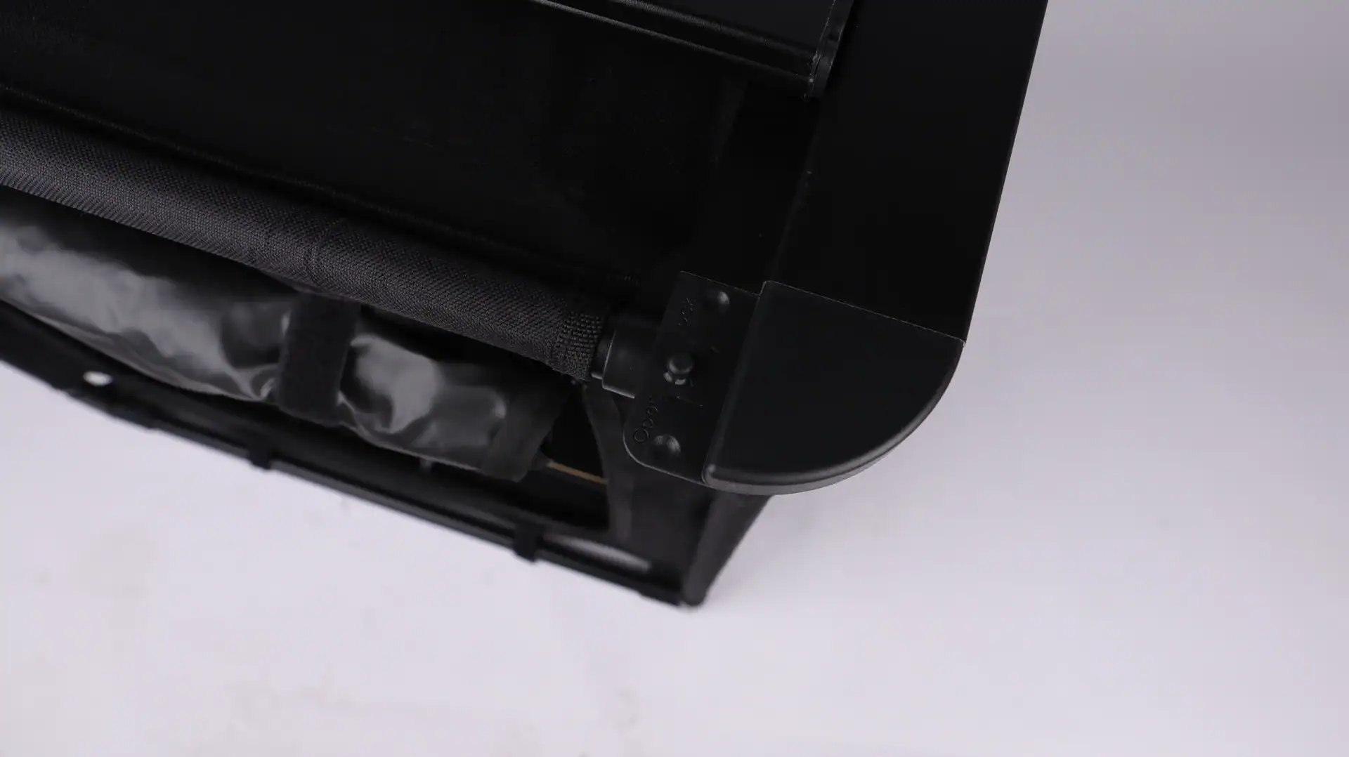 Close-up of a black outdoor equipment case with a handle and latch.