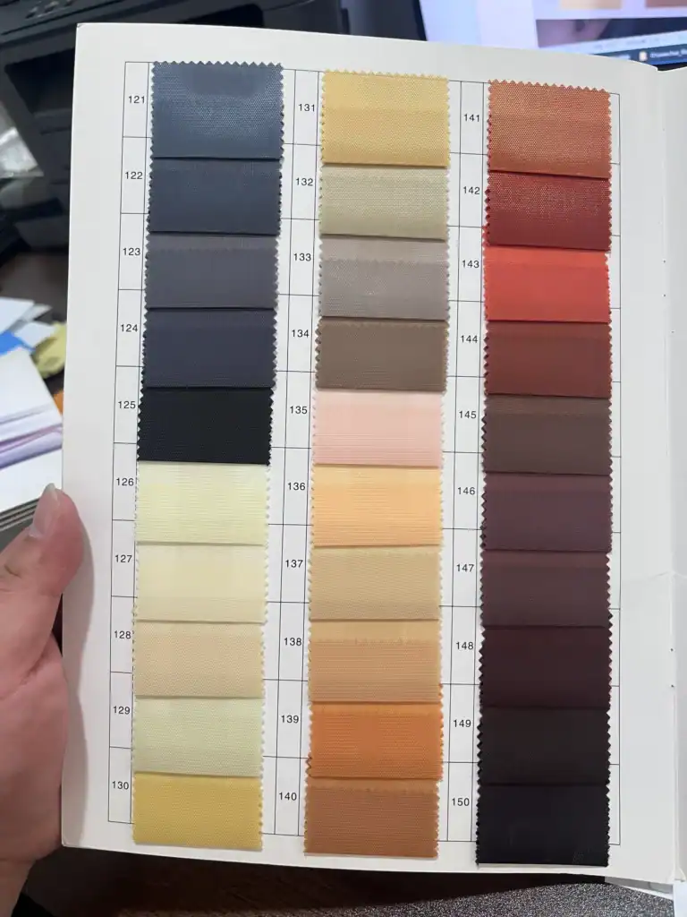 Custom Folding Wagon Design Options: From Fabric to Frame 2 A fabric color swatch chart displaying multiple shades, including blues, yellows, reds, and neutrals, in an organized grid format.