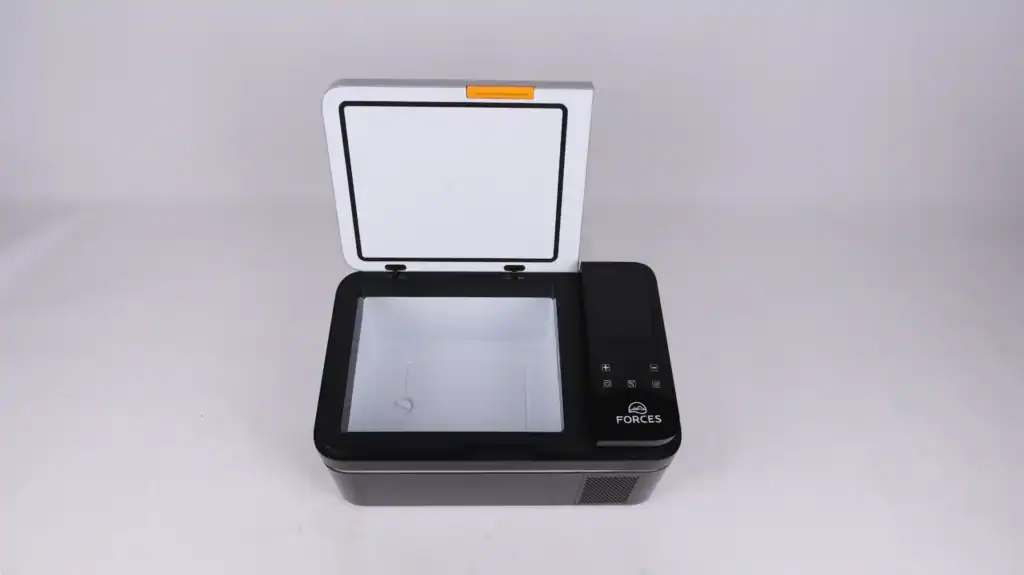 Portable electric cooler box with an open lid, featuring a clean white interior and control panel on the right side.