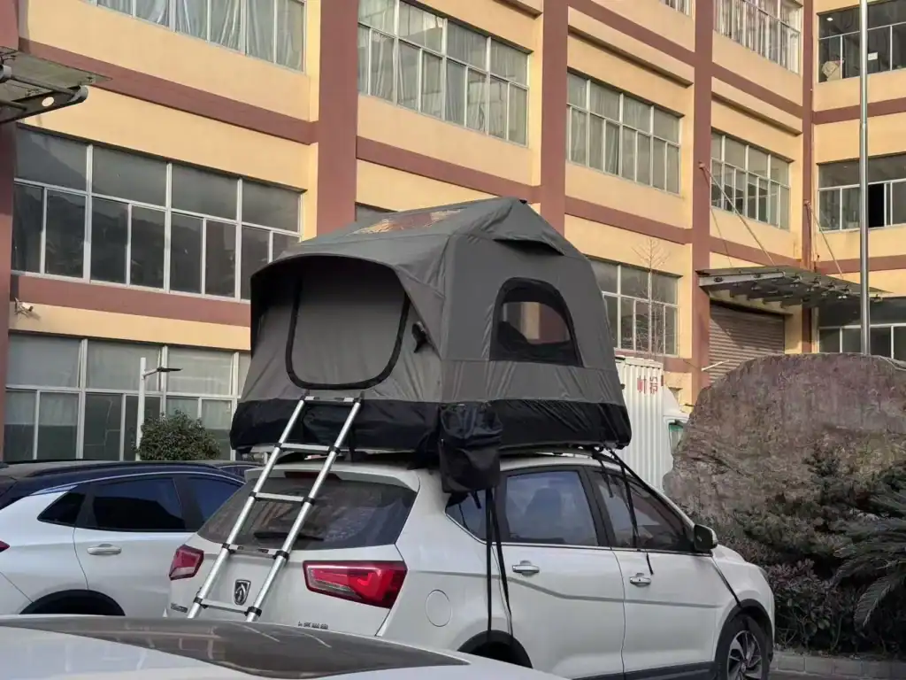 Inflatable Camping Tents Wholesale: 2026 Sourcing & QC Guide 3 Silver SUV with rooftop tent parked near a building in outdoor setting.