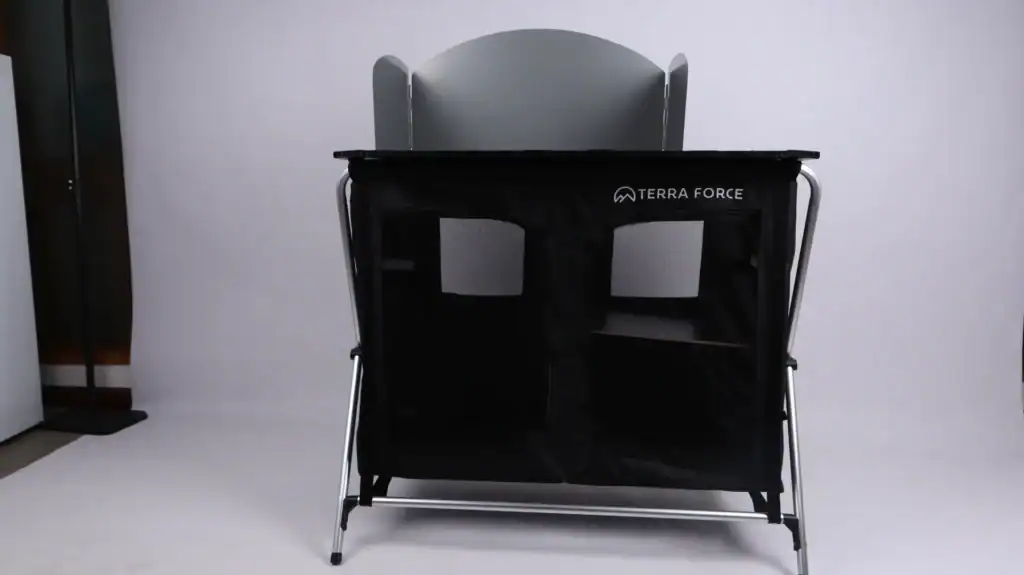 Tierra Force portable outdoor camping table with storage compartments.