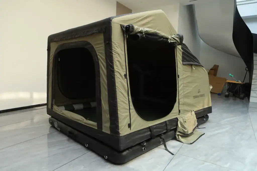 Portable outdoor tent with mesh windows and beige fabric for camping or outdoor activities.